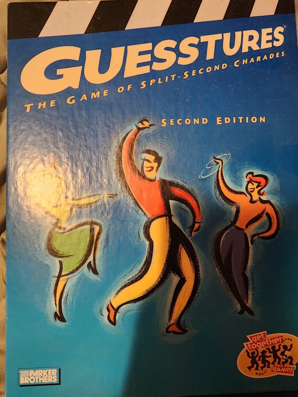 Hasbro Guesstures Party Game - Blue Box with Red, Yellow, Green Accents